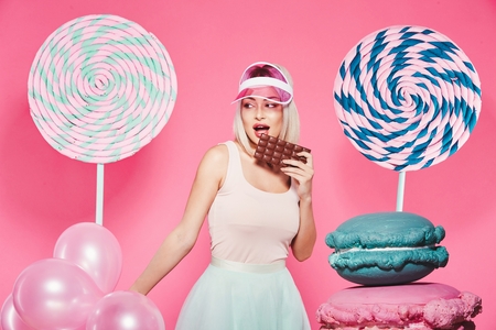 Attractive model with sweetsの写真素材