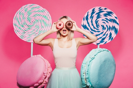 Attractive model with sweetsの写真素材