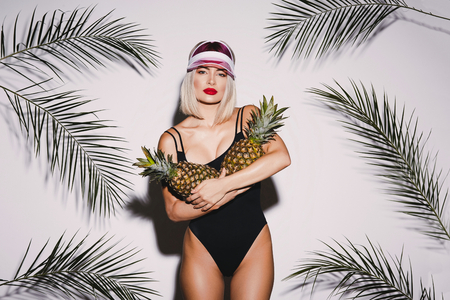 Girl with pineapplesの写真素材