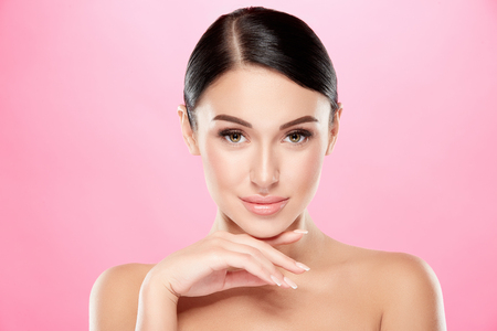 Darkhaired girl with nude make up at studioの写真素材