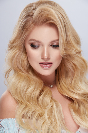 portrait of amazing blondie woman with beautiful hairstyleの写真素材