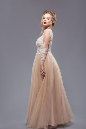 pretty lady with red lips in elegant evening dressの写真素材