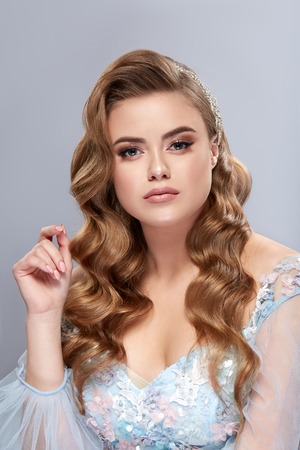 portrait of beautiful woman with sexy breast and shiny hairの写真素材