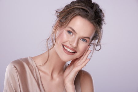 Gorgeous woman at gray backgroundの写真素材
