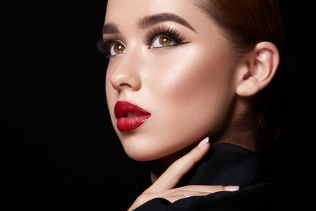 Brunette girl with red lipsの写真素材
