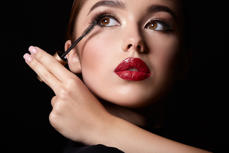 Using mascara at black backgroundの写真素材