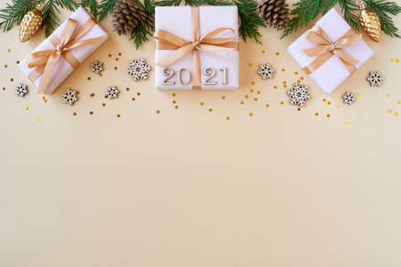 Christmas flat lay  with fir tree, present box and decorations.