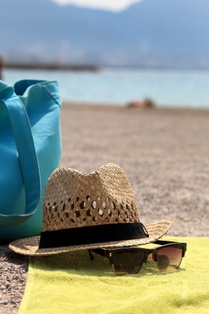 Hat, beach bag and the glasses on the rugの写真素材