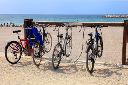 Parking for municipal Bicycle on the beach in Marseille, France の写真素材