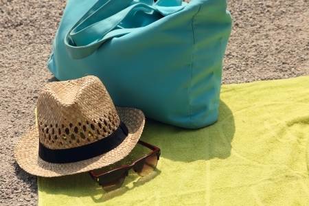 Hat, beach bag and the glasses on the rugの写真素材