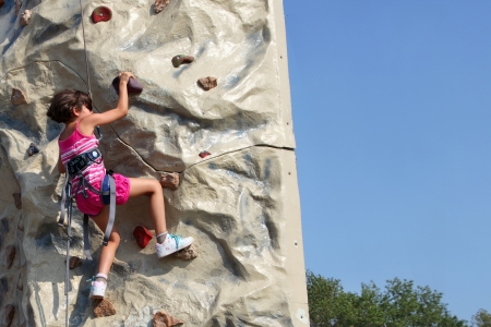 MARSEILLE, FRANCE - AUGUST  Young climber on a steep rock  Marseille Festival Association on august - september, 2012 in Park Borelli, Marseille, Franceのeditorial素材