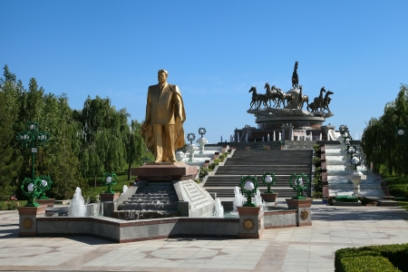 Monumen of Niyazov and sculptural composition to fast horses in the park  Ashkhabad  Turkmenistan のeditorial素材