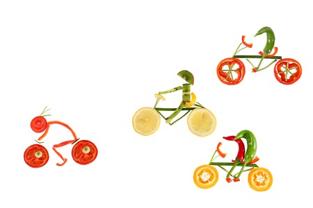 Healthy eating  Five little funny peppers on bicycles の写真素材