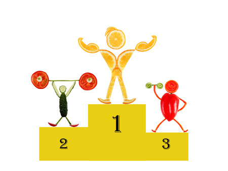 Healthy eating  Little funny people made of vegetables and fruits  On Victory Podiumの写真素材