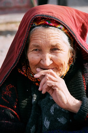 Ashgabat, Turkmenistan - July 29   Portrait of old unidentified  Asian woman  Woman in traditional national dress  Oriental bazaar   Ashgabat, Turkmenistan - July 29  2013  のeditorial素材