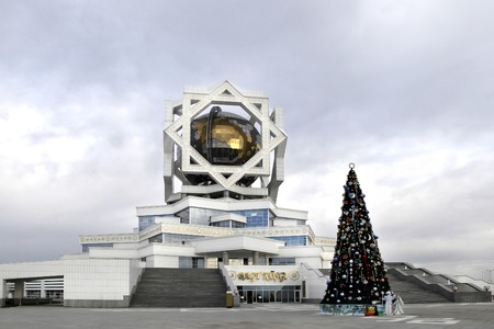 ASHGABAT, TURKMENISTAN - CIRCA DECEMBER 2014: Christmas fir-tree in front of beautiful palace circa December 2014.  Ashgabat is the capital of Turkmenistan.のeditorial素材