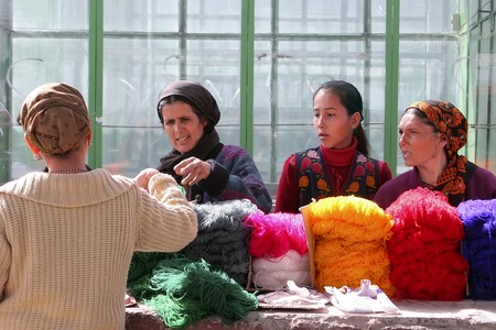 Ashgabat, Turkmenistan - February 26. Women on a market buy a yarn. Ashgabat, Turkmenistan - February 26. 2013.のeditorial素材