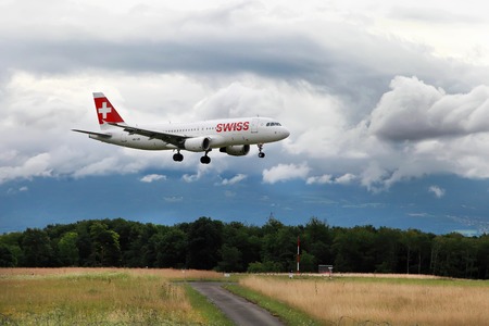 Geneva, Switzerland - JULY 12, 2014. Swiss International Air Lines Airbus is going to land at Geneva airport.のeditorial素材