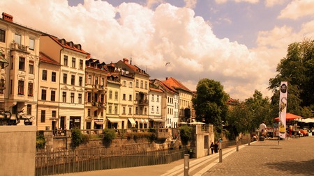 LJUBLJANA, SLOVENIA - JULY 28, 2014: Old town embankment in Ljubljana. Ljubljana is the business and cultural center of the country.のeditorial素材