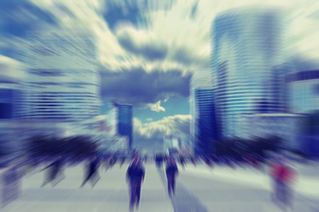 Business people in the street in Paris, Radial zoom blur effect defocusing filter applied