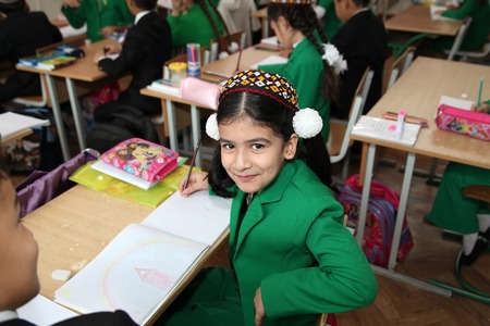 Ashgabad, Turkmenistan - November 4, 2014. Portrait of an unknown schoolgirl in the classroom.  November 4, 2014.  In schools of Turkmenistan annually trains about 900 thousand children.のeditorial素材