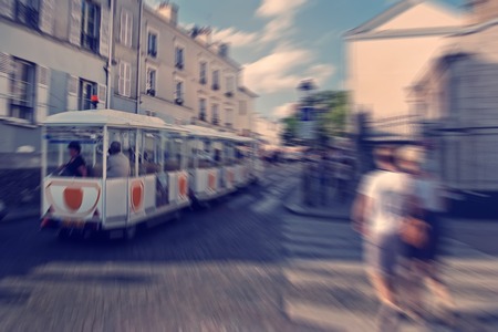 Abstract background. Tourists walking on Montmartre.  Blur effect defocusing