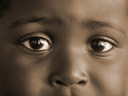 ACCRA, GHANA - July 1, 2014.  Unidentified Ghanaian little girl with big eyes. People of Ghana suffer of poverty due to the difficult economic situationのeditorial素材
