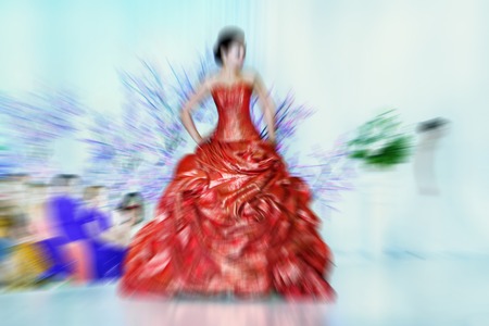 Abstract background - fashion models on catwalk - radial zoom blur effect defocusing filter applied, with vintage instagram look.の写真素材
