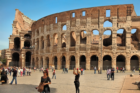 ROME, ITALY - APRIL 7, 2016: Tourists visiting the Colosseum on APRIL 7, 2016 in Rome, Italy. The Colosseum is a major tourist attraction in Romeのeditorial素材