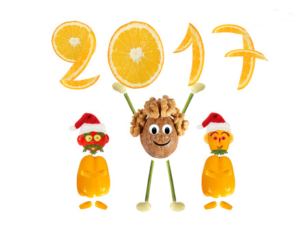 Healthy eating. Funny little  walnut with two Santa Claus raises 2017.