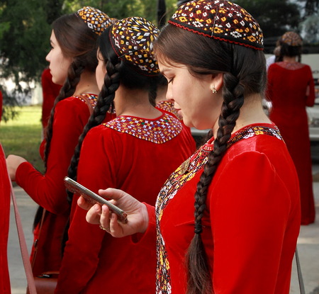  Ashgabat, Turkmenistan - May 25, 2017:  Group of students in national dress on outdoor.  Ashgabat, Turkmenistan, May 25, 2017.のeditorial素材