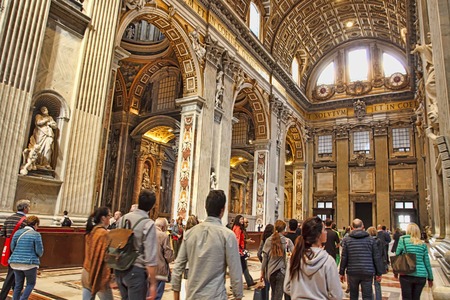 Rome, Italy - APRIL 10, 2016: Tourists are visiting St. Peter's Basilica in the Vatican. St. Peter's Basilica is one of the main tourist attractions of Rome.のeditorial素材