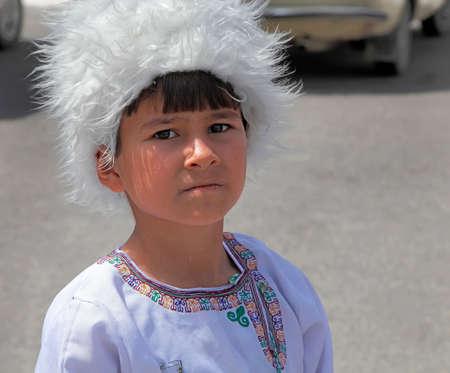 Ashgabat, Turkmenistan - September, 12, 2017.  Portrait of  unidentified serious  Asian boy.  Boy in traditional national  clothes.のeditorial素材