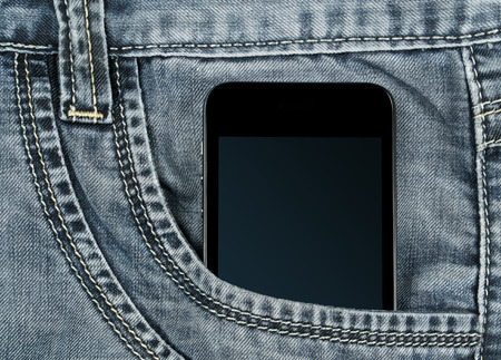 graded-screen smartphone in your pocket gray jeansの写真素材