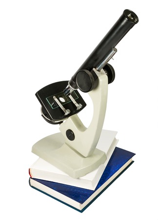 microscope and books isolated on white backgroundの写真素材