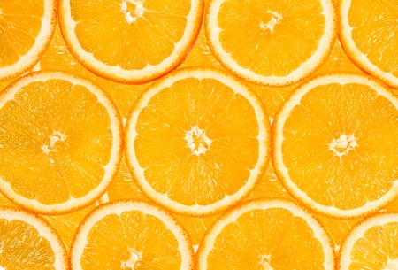 background of the many fresh orange fruit slices