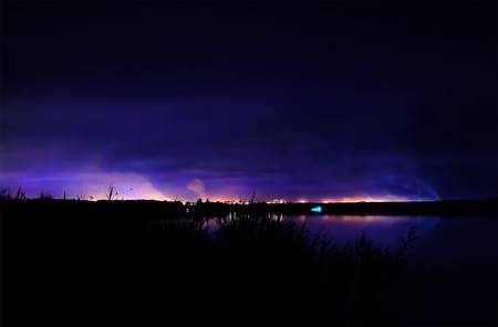 Night coastline, view on the town of Kryvyi Rig from the river. Ukraine.の写真素材