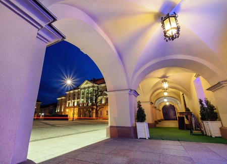 View from under the arches on market sqare Rynek and City Hall in Kielce.のeditorial素材