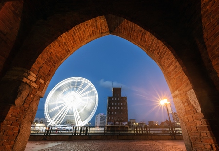 Ferris wheel in the Gdansk view from under the arch.の写真素材