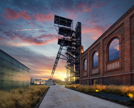 The former coal mine "Katowice", seat of the Silesian Museum. The complex combines old mining buildings and infrastructure with modern architecture. Poland. Europe, during sunset.のeditorial素材