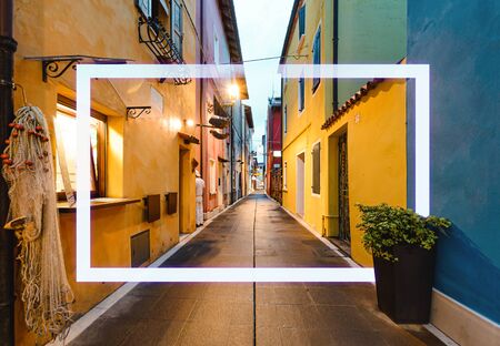Narrow colorfull street with frame in the old sity of Europe.