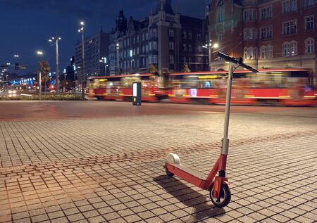 electric scooter in the centre of big city.の写真素材