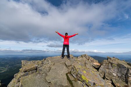 girl athlete on top of the mountain.