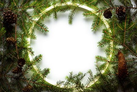 Christmas round frame made by neon and winter things on white background.の写真素材
