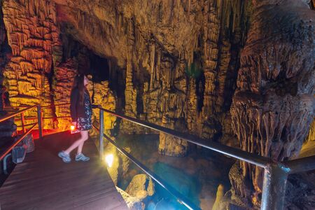 Girl tourist in Dikteo Andro Cave also known as birth place of Zeus in Creteの写真素材