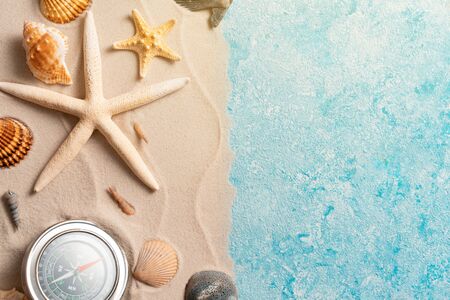 Creative layout of sand waves and sea, summer beach background with shell, sea star, compas,...