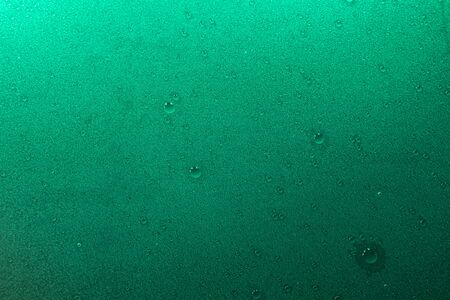 drops texture in neon light, green color, Flat lay top view copy spaceの写真素材