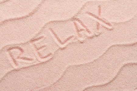 LOVE lettering on sand with wave. Minimal exotic Sand, shells, vacation and travel concept, Flat lay...