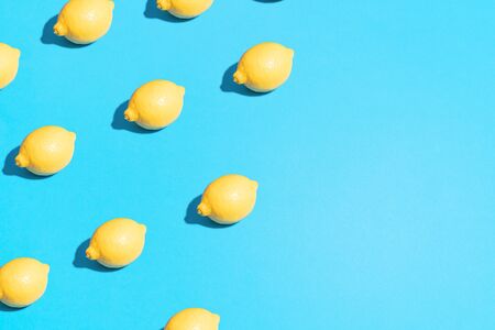 Minimal flat lay food texture. Summer abstract trendy fresh concept. Lemon pattern on bright light...