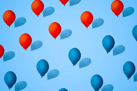 balloons red and blue color. Symbol of division of society. Concept of confrontation between races,...